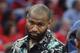 New Orleans Pelicans center DeMarcus Cousins walks on the court in street clothes during the first half of Game 3 of the team's first-round NBA basketball playoff series against the Portland Trail Blazers in New Orleans, Thursday, April 19, 2018. (AP Photo/Veronica Dominach)