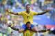  TOPSHOT - Brazil's forward Neymar celebrates with Brazil's midfielder Paulinho after scoring the opening goal during the 2018 World Cup round of 16 football match between Brazil and Mexico City at the Samara Arena in Samara on July 2, 2018. (Photo by Fabrice COFFRINI / AFP) (Photo credit should read FABRICE COFFRINI / AFP / Getty Images) 