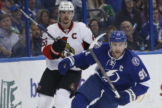 Tampa Bay Lightning center Steven Stamkos (91) skates against Ottawa Senators defenseman Erik Karlsson (65), of Sweden, during the second period of an NHL hockey game, Sunday, Dec. 20, 2015, in Tampa, Fla. (AP Photo/Brian Blanco)