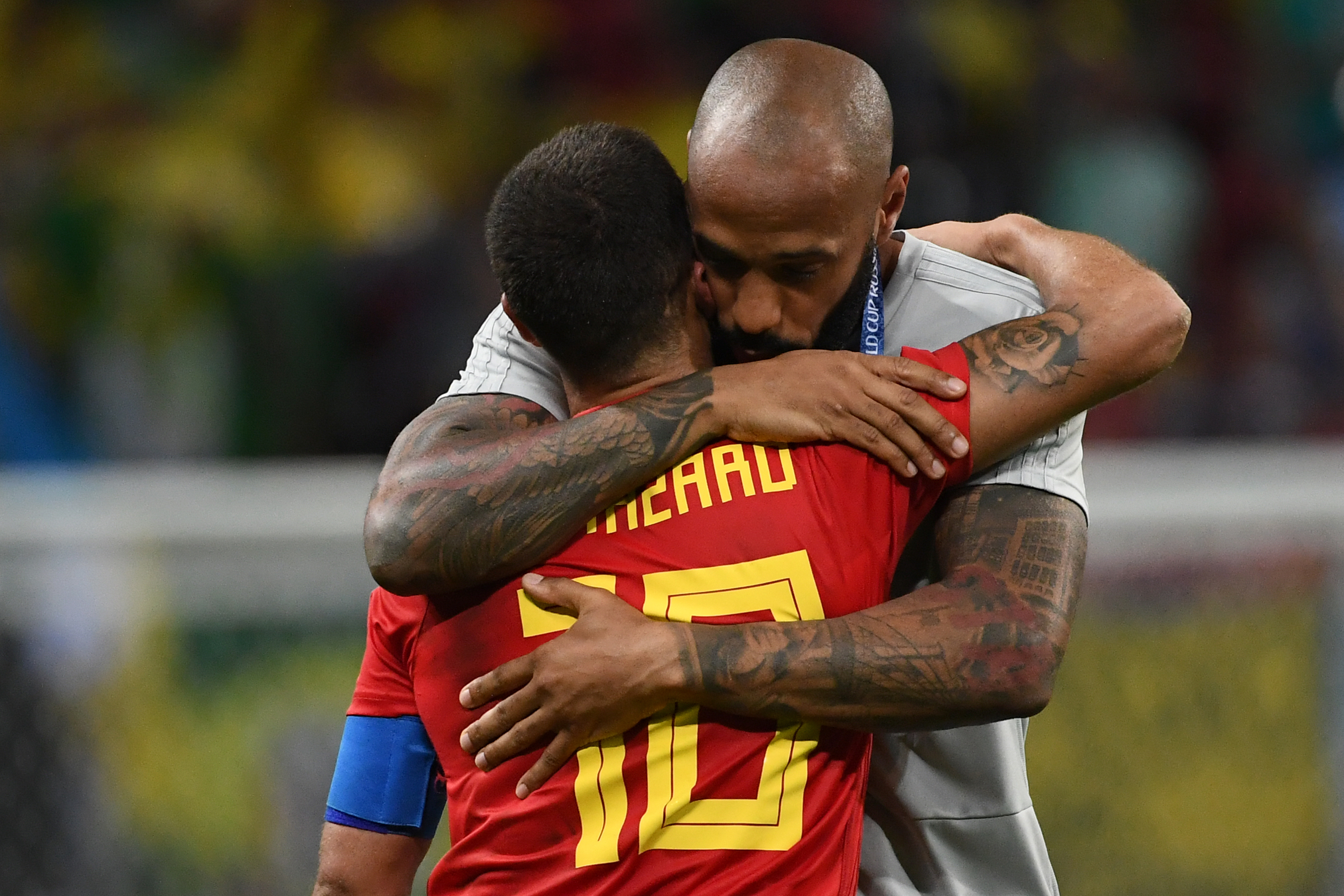 Belgium's forward Eden Hazard (L) is congratulated by Thierry Henry, Belgium's second assistant coach, during the Russia 2018 World Cup quarter-final football match between Brazil and Belgium at the Kazan Arena in Kazan on July 6, 2018. - Belgium beat World Cup favourites Brazil 2-1 on Friday to set up a semi-final against France in Saint Petersburg. (Photo by Jewel SAMAD / AFP) / RESTRICTED TO EDITORIAL USE - NO MOBILE PUSH ALERTS/DOWNLOADS (Photo credit should read JEWEL SAMAD/AFP/Getty Images)