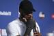 Cleveland Cavaliers forward LeBron James wipes his face during a news conference following Game 4 of basketball's NBA Finals against the Golden State Warriors, early Saturday, June 9, 2018, in Cleveland. The Warriors defeated the Cavaliers 108-85 to win the NBA championship. (AP Photo/Carlos Osorio)