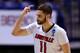 INDIANAPOLIS, IN - MARCH 28: Luke Hancock #11 of the Louisville Cardinals reacts to a play against the Kentucky Wildcats during the regional semifinal of the 2014 NCAA Men's Basketball Tournament at Lucas Oil Stadium on March 28, 2014 in Indianapolis, Indiana. (Photo by Andy Lyons/Getty Images)