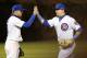 Chicago Cubs' Javier Baez, left, and Kyle Schwarber celebrate the Cubs' 8-3 win over the Philadelphia Phillies after a baseball game Tuesday, May 2, 2017, in Chicago. (AP Photo/Charles Rex Arbogast)