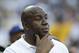 FILE - In this May 27, 2014, file photo, Magic Johnson watches before a baseball game between the Los Angeles Dodgers and Cincinnati Reds in Los Angeles. Magic Johnson says he's pleased pro athletes are supporting peaceful protests around the nation by using