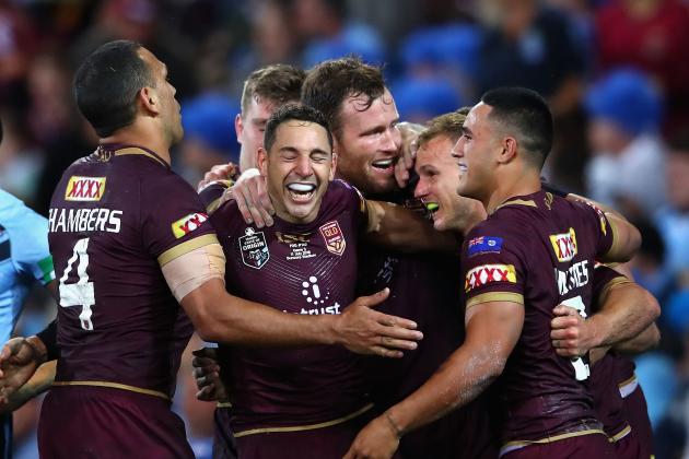 BRISBANE, AUSTRALIA - JULY 11:  Daly Cherry-Evans of Queensland is congratulated by team mates after scoring a try during game three of the State of Origin series between the Queensland Maroons and the New South Wales Blues at Suncorp Stadium on July 11, 2018 in Brisbane, Australia.  (Photo by Cameron Spencer/Getty Images)