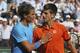 Serbia's Novak Djokovic hugs Spain's Rafael Nadal, left, after winning the quarterfinal match of the French Open tennis tournament in three sets, 7-5, 6-3, 6-1, at the Roland Garros stadium, in Paris, France, Wednesday, June 3, 2015. (AP Photo/David Vincent)