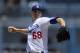 CORRECTS TO STARTING PITCHER NOT RELIEF PITCHER - Los Angeles Dodgers starting pitcher Ross Stripling throws to the plate during the first inning of a baseball game against the Colorado Rockies, Sunday, July 1, 2018, in Los Angeles. (AP Photo/Mark J. Terrill)
