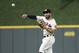 Houston Astros second baseman Jose Altuve throws to first after fielding a hit by Oakland Athletics' Jonathan Lucroy during the third inning of a baseball game Monday, July 9, 2018, in Houston. (AP Photo/David J. Phillip)