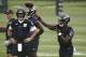Baltimore Ravens quarterback Joe Flacco (5) watches quarterback Lamar Jackson throw a pass during an NFL football organized team activity at the team's headquarters in Owings Mills, Md., Thursday, May 31, 2018. (AP Photo/Patrick Semansky)