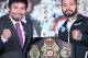 Philippine's Manny Pacquiao (L) and Argentina's Lucas Matthysse (R) pose for pictures with the welterweight championship belt after the press conference on July 12, 2018, ahead their fight on July 15. (Photo by Mohd RASFAN / AFP) (Photo credit should read MOHD RASFAN/AFP/Getty Images)