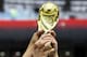 TOPSHOT - England fans hold a replica of the World Cup trophy before the Russia 2018 World Cup semi-final football match between Croatia and England at the Luzhniki Stadium in Moscow on July 11, 2018. (Photo by Kirill KUDRYAVTSEV / AFP) / RESTRICTED TO EDITORIAL USE - NO MOBILE PUSH ALERTS/DOWNLOADS (Photo credit should read KIRILL KUDRYAVTSEV/AFP/Getty Images)