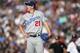 Los Angeles Dodgers starting pitcher Walker Buehler reacts after giving up an RBI-single to Colorado Rockies' Charlie Blackmon in the second inning of a baseball game Saturday, June 2, 2018, in Denver. (AP Photo/David Zalubowski)