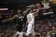 HOUSTON, TX - DECEMBER 22: Austin Rivers #25 of the LA Clippers goes up for a lay up defended by James Harden #13 of the Houston Rockets in the second half at Toyota Center on December 22, 2017 in Houston, Texas. NOTE TO USER: User expressly acknowledges and agrees that, by downloading and or using this Photograph, user is consenting to the terms and conditions of the Getty Images License Agreement. (Photo by Tim Warner/Getty Images)