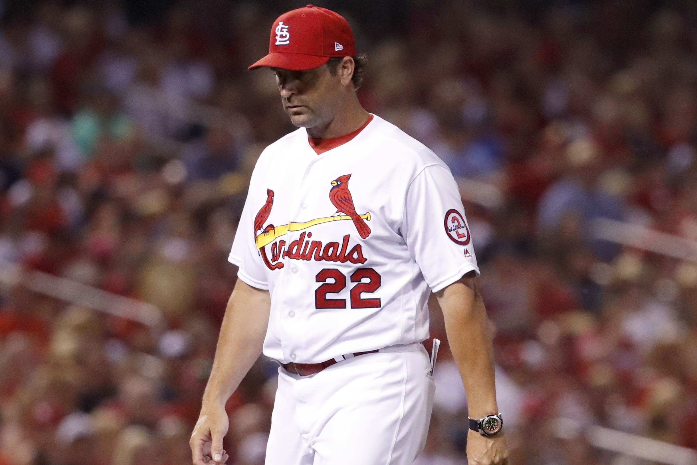 St. Louis Cardinals catcher Mike Matheny, left, and starting pitcher Chris  Carpenter (29) confer on the mound in the fourth inning against the Arizona  Diamondbacks, Saturday, Sept. 18, 2004, in St. Louis.