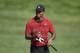 Tiger Woods smiles as he walks on the 16th fairway during the final round of the Quicken Loans National golf tournament, Sunday, July 1, 2018, in Potomac, Md. (AP Photo/Nick Wass)