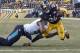 Pittsburgh Steelers running back Le'Veon Bell (26) scores as he is hit byJacksonville Jaguars defensive end Calais Campbell (93) after taking a pass from quarterback Ben Roethlisberger during the second half of an NFL divisional football AFC playoff game in Pittsburgh, Sunday, Jan. 14, 2018. (AP Photo/Don Wright)