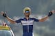France's Julian Alaphilippe celebrates as he crosses the finish line to win the tenth stage of the 105th edition of the Tour de France cycling race between Annecy and Le Grand-Bornand, French Alps, on July 17, 2018. (Photo by Marco BERTORELLO / AFP) / ALTERNATIVE CROP (Photo credit should read MARCO BERTORELLO/AFP/Getty Images)