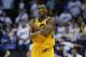 Utah Jazz guard Donovan Mitchell (45) celebrates after the Jazz defeated the Oklahoma City Thunder in Game 2 of an NBA basketball first-round playoff series in Oklahoma City, Wednesday, April 18, 2018. (AP Photo/Sue Ogrocki)