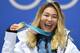 TOPSHOT - USA's gold medallist Chloe Kim poses on the podium during the medal ceremony for the snowboard women's Halfpipe at the Pyeongchang Medals Plaza during the Pyeongchang 2018 Winter Olympic Games in Pyeongchang on February 13, 2018. / AFP PHOTO / Kirill KUDRYAVTSEV (Photo credit should read KIRILL KUDRYAVTSEV/AFP/Getty Images)