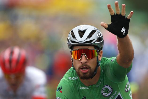 Slovakia's Peter Sagan, wearing the best sprinter's green jersey, crosses the finish line to win the thirteenth stage of the Tour de France cycling race over 169.5 kilometers (105.3 miles) with start in Bourg d'Oisans and finish in Valence, France, Friday July 20, 2018. (AP Photo/Peter Dejong)
