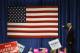 Republican presidential candidate Donald Trump points to the American flag after speaking at a campaign rally at the University of Northern Colorado, in Greeley, Colo., Sunday, Oct. 30, 2016. (AP Photo/ Brennan Linsley)