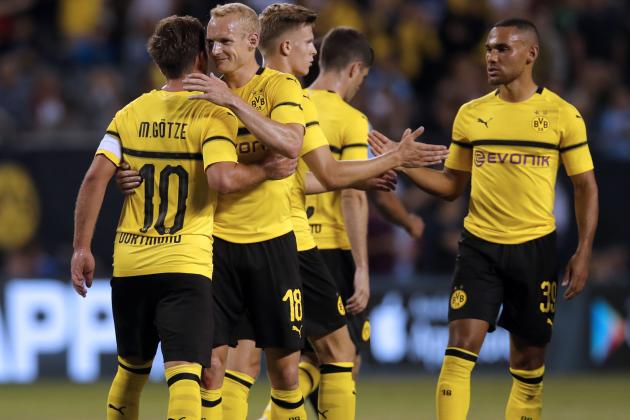Borussia Dortmund's Mario Gotze (L) celebrates his goal with Sebastian Rode (2-L) during the 2018 International Champions Cup against Manchester City at Soldier Field in Chicago, July 20, 2018. (Photo by JIM YOUNG / AFP)        (Photo credit should read JIM YOUNG/AFP/Getty Images)
