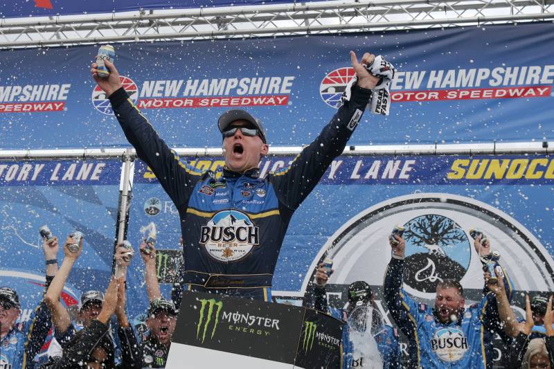Kevin Harvick celebrates in Victory Lane after winning a NASCAR Cup Series auto race Sunday, July 22, 2018, at New Hampshire Motor Speedway in Loudon, N.H. (AP Photo/Mary Schwalm)