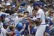 Chicago Cubs' Kris Bryant, right, autographs for fans before a baseball game against the St. Louis Cardinals, Sunday, July 22, 2018, in Chicago. (AP Photo/Nam Y. Huh)