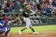 CORRECTS TO NINTH INNING, INSTEAD OF EIGHTH - Oakland Athletics' Khris Davis hits a two-run home run off Texas Rangers relief pitcher Jose Leclerc during the ninth inning of a baseball game Wednesday, July 25, 2018, in Arlington, Texas. Oakland won 6-5. (AP Photo/Jeffrey McWhorter)