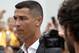 Portuguese footballer Cristiano Ronaldo walks out the Juventus medical center at the Alliance stadium in Turin on July 16, 2018 to greet supporters. - A Turin hit by Cristiano Ronaldo fever awaits the striker as Juventus prepare to unveil the surprise signing, that after the end of the World Cup, puts all eyes on the Italian champions and Serie A. (Photo by Isabella Bonotto / AFP) (Photo credit should read ISABELLA BONOTTO/AFP/Getty Images)