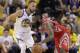 Houston Rockets guard James Harden, right, drives against Golden State Warriors guard Stephen Curry (30) during the second half of Game 3 of the NBA basketball Western Conference Finals in Oakland, Calif., Sunday, May 20, 2018. (AP Photo/Marcio Jose Sanchez)