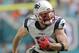 New England Patriots wide receiver Julian Edelman (11) runs the ball, during the first half of an NFL football game against the Miami Dolphins, Sunday, Jan. 1, 2017, in Miami Gardens, Fla. (AP Photo/Alan Diaz)