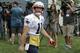 New England Patriots wide receiver Julian Edelman walks past members of the media as he steps on the field at the start of an NFL football practice, Thursday, July 26, 2018, in Foxborough, Mass. (AP Photo/Steven Senne)