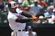 Baltimore Orioles' Adam Jones follows through on a single against the Tampa Bay Rays in the fourth inning of a baseball game, Sunday, July 29, 2018, in Baltimore. (AP Photo/Gail Burton)