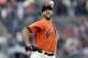 San Francisco Giants starting pitcher Madison Bumgarner throws to an Oakland Athletics during the first inning of a baseball game Friday, July 13, 2018, in San Francisco. (AP Photo/Marcio Jose Sanchez)