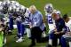 FILE - This Monday, September 25, 2017, file photo, the Dallas Cowboys, led by owner Jerry Jones, center, one knee to the national anthem and an NFL football game against the Arizona Cardinals, in Glendale, Ariz, ESPN anchor Jemele Hill was suspended from the network for two weeks to make political statements on social media. Hill, who is an African American, received criticism from the network last month after he made headlines on President Donald Trump as a