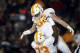 FILE - In this Nov. 11, 2017, file photo, Tennessee tight end Ethan Wolf, top, is congratulated by Trey Smith after catching a touchdown pass during the first half of an NCAA college football game against Missouri in Columbia, Mo. Wolf was one of the Tennessee seniors who arrived on campus three years ago amid expectations that they would lead the program back to Southeastern Conference title contention. It didn't quite work out that way. Only a fraction of that class remains as those seniors prepare to close their careers, and the coach who recruited them has been fired. (AP Photo/Jeff Roberson, File)