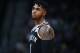 Brooklyn Nets guard D'Angelo Russell reacts as he heads to the bench while facing the Denver Nuggets in the first half of an NBA basketball game Tuesday, Nov. 7, 2017, in Denver. (AP Photo/David Zalubowski)