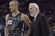 San Antonio Spurs guard Manu Ginobili (20) and head coach Gregg Popovich during the first half of an NBA basketball game against the Golden State Warriors in Oakland, Calif., Thursday, March 8, 2018. (AP Photo/Jeff Chiu)
