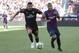 AC Milan defender Mateo Musacchio (22) moves the ball next to FC Barcelona forward Rafael Alcantara during the first half during an International Champions Cup soccer match in Santa Clara, Calif., Saturday, Aug. 4, 2018. (AP Photo/Tony Avelar)