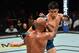 LOS ANGELES, CA - AUGUST 04: (R-L) Henry Cejudo kicks Demetrious Johnson in their UFC flyweight championship fight during the UFC 227 event inside Staples Center on August 4, 2018 in Los Angeles, California. (Photo by Jeff Bottari/Zuffa LLC/Zuffa LLC via Getty Images)