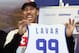 Los Angeles entrepreneur LaVar Ball holds up a jersey a press conference in Prienai, Lithuania, where his sons LaMelo Ball, LiAngelo Ball will play for the Vytautas club on January 5, 2018.
Basketball-crazed Lithuania welcomed LiAngelo and LaMelo Ball, the two youngest sons of flamboyant Los Angeles entrepreneur LaVar Ball who recently made headlines due to a feud with US President Donald Trump. / AFP PHOTO / Petras Malukas (Photo credit should read PETRAS MALUKAS/AFP/Getty Images)