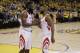 Houston Rockets' Chris Paul, right ,shakes hands with teammate James Harden during the second half in Game 4 of the NBA basketball Western Conference Finals against the Golden State Warriors Tuesday, May 22, 2018, in Oakland, Calif. (AP Photo/Marcio Jose Sanchez)