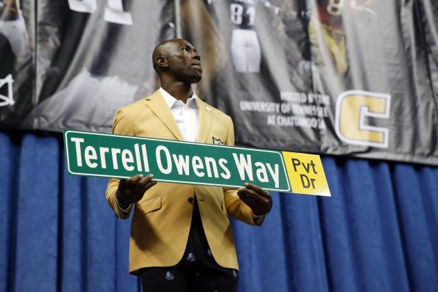 Former wide receiver Terrell Owens holds a street sign after a road was named after him following his NFL Pro Football Hall of Fame speech on Saturday, Aug. 4, 2018, in Chattanooga, Tenn. Instead of speaking at the Hall of Fame festivities in Canton, Ohio, Owens celebrated his induction at the University of Tennessee at Chattanooga, where he played football and basketball and ran track. (AP Photo/Mark Humphrey)