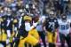 PITTSBURGH, PA - JANUARY 14: Antonio Brown #84 of the Pittsburgh Steelers runs for yards after reception during the second half of the AFC Divisional Playoff game against the Jacksonville Jaguars at Heinz Field on January 14, 2018 in Pittsburgh, Pennsylvania. Jaguars defeat Pittsburgh 45-42. (Photo by Brett Carlsen/Getty Images)