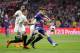Barcelona's Philippe Coutinho, right, duels for the ball with Sevilla's Sergio Escudero, left, and Clement Lenglet during the Copa del Rey final soccer match between Barcelona and Sevilla at the Wanda Metropolitano stadium in Madrid, Spain, Saturday, April 21, 2018. (AP Photo/Paul White)