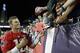 New England Patriots quarterback Tom Brady, left, signs autographs for fans following an NFL football practice, Monday, July 30, 2018, at Gillette Stadium, in Foxborough, Mass. (AP Photo/Steven Senne)
