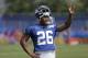 New York Giants' Saquon Barkley waves to fans during NFL football training camp in East Rutherford, N.J., Tuesday, Aug. 7, 2018. (AP Photo/Seth Wenig)