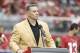Former Arizona Cardinals quarterback Kurt Warner shows his ring to the fans during his Football Hall of Fame ring ceremony at half time of an NFL football game against the San Francisco 49ers, Sunday, Oct. 1, 2017, in Glendale, Ariz. (AP Photo/Rick Scuteri)