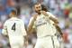 Real Madrid's Karim Benzema, right, celebrates after scoring their side's first goal against AC Milan during the Santiago Bernabeu trophy soccer match between Real Madrid and AC Milan at the Santiago Bernabeu stadium, in Madrid, Saturday, Aug. 11, 2018. (AP Photo/Andrea Comas)